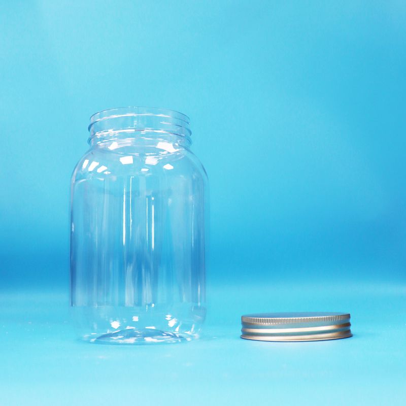 Makanan Kelas Jelas PET Plastik Bulat Jar Aluminium Sekrup Flat Cap Untuk Makanan Permen Kacang