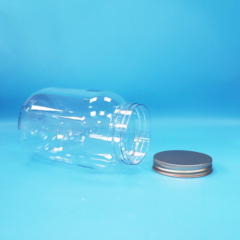 Makanan Kelas Jelas PET Plastik Bulat Jar Aluminium Sekrup Flat Cap Untuk Makanan Permen Kacang