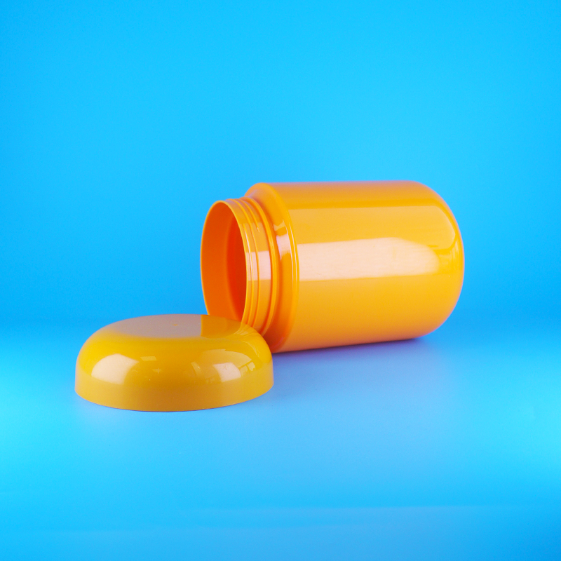 Toples Permen Plastik PET Oranye Food Grade Bentuk Bulat dengan Tutup Ulir Datar Oranye